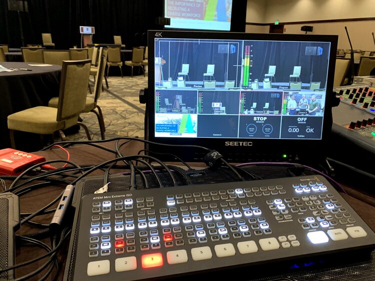 Audio/video equipment set up in an empty conference room.