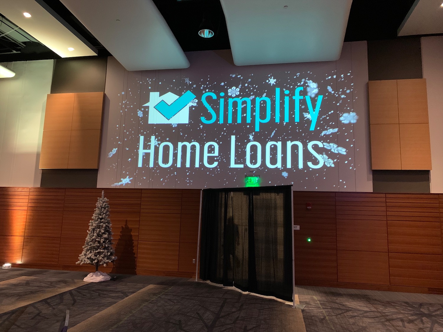 A conference projector that says Simplify Home Loans.