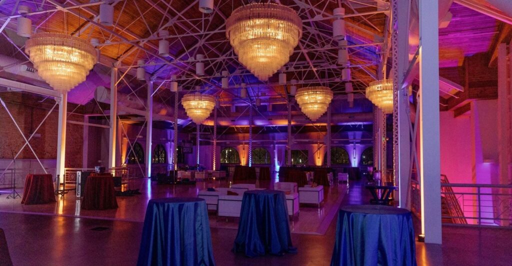 Grand Upstairs Image 1 Inside of Utah State Fairpark Grand Building. Orange and Purple lighting by Charisma Event Productions